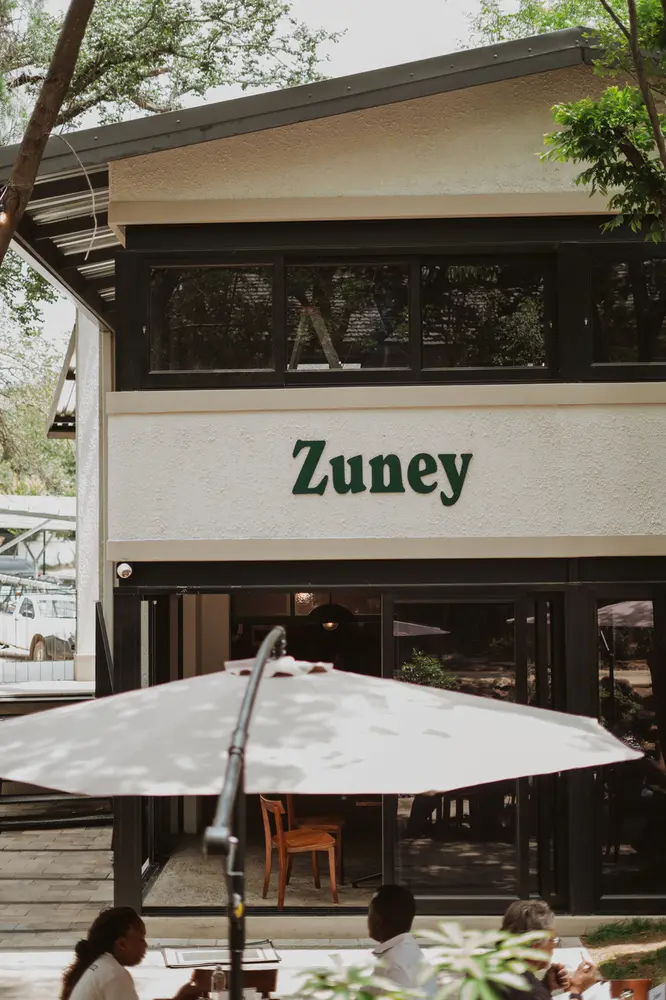 The Zuney building with a patio umbrella in front